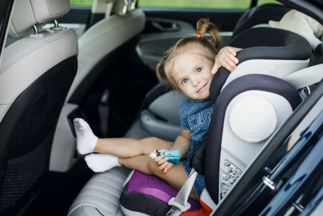 cute little baby child sitting car seat